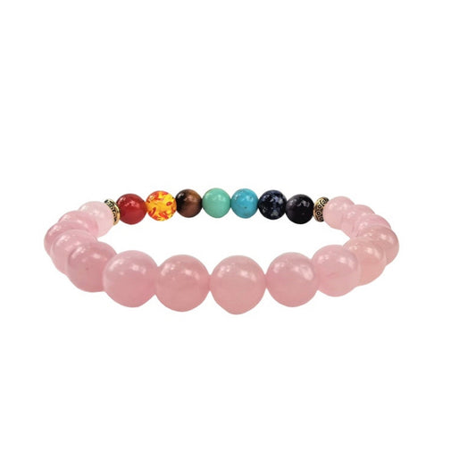 Bracelet with rose quartz beads and a row of colorful chakra beads on a white background