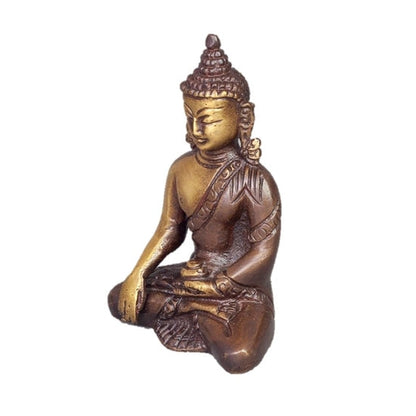 Bronze Buddha statue in meditation pose on a white background