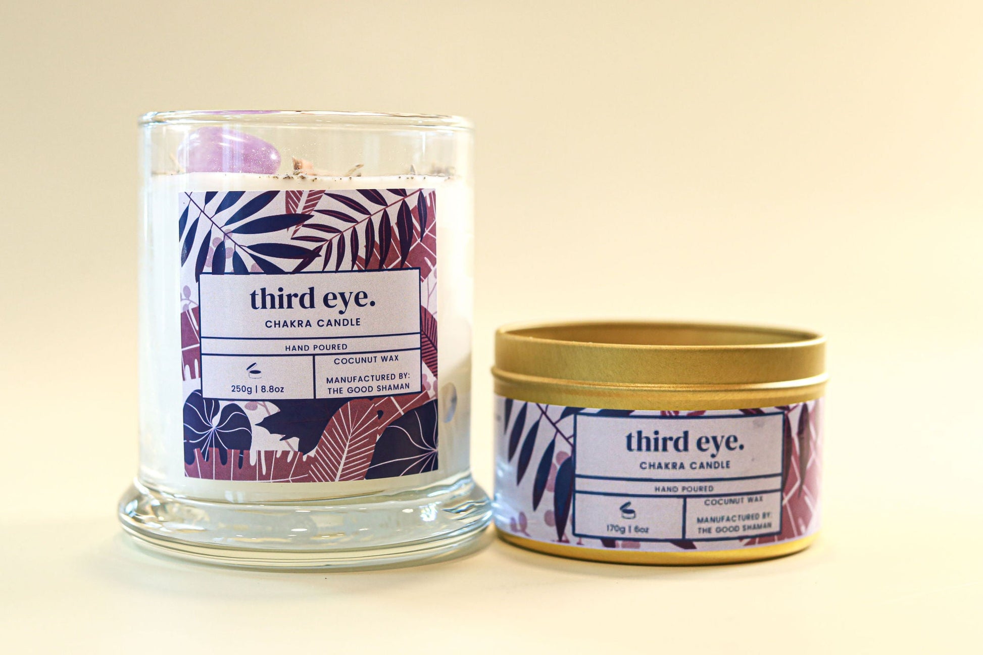 Two candles with 'third eye' branding on a beige background