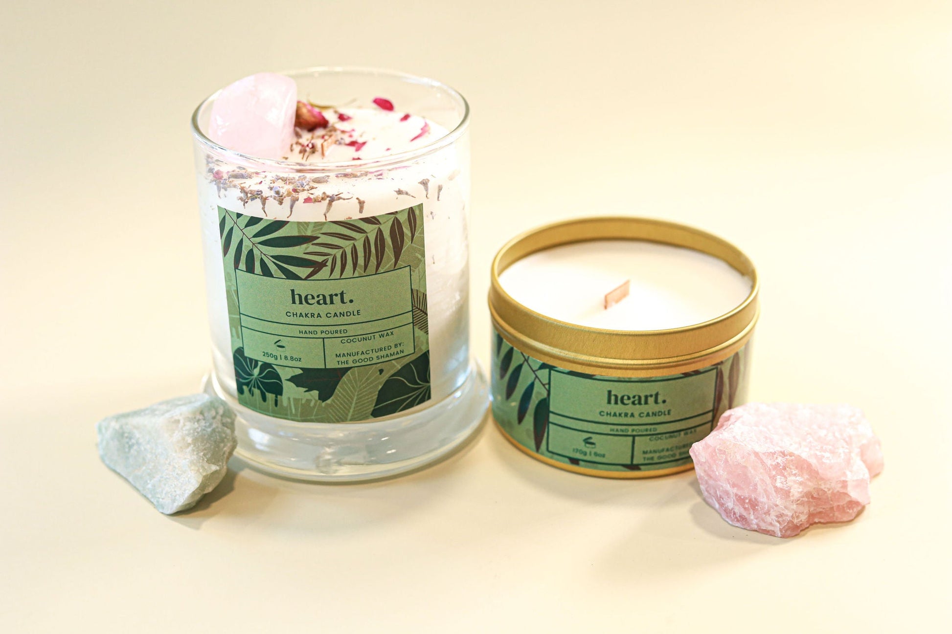 Two candles with 'heart.' branding on a light background