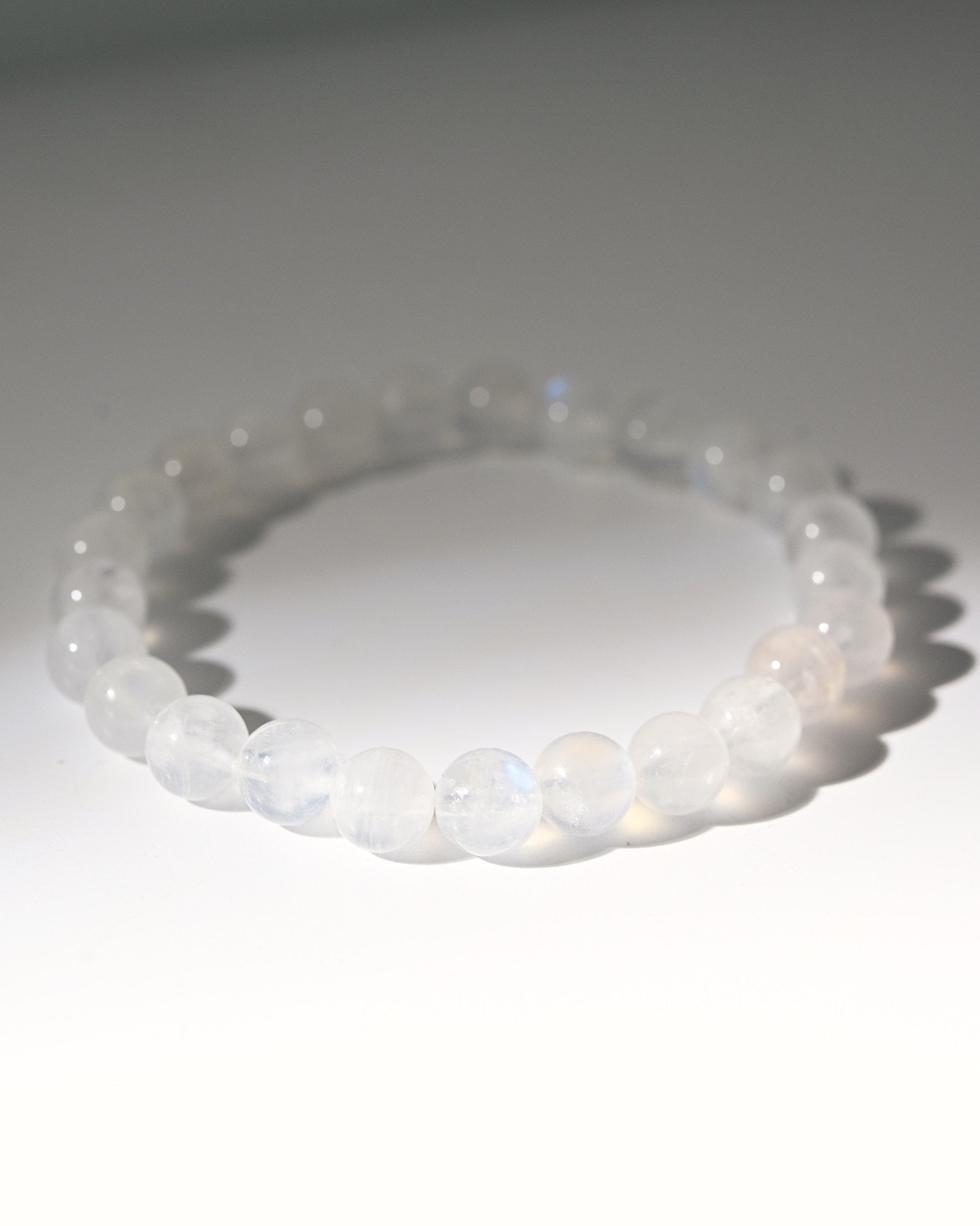 White moonstone beaded bracelet on a white background