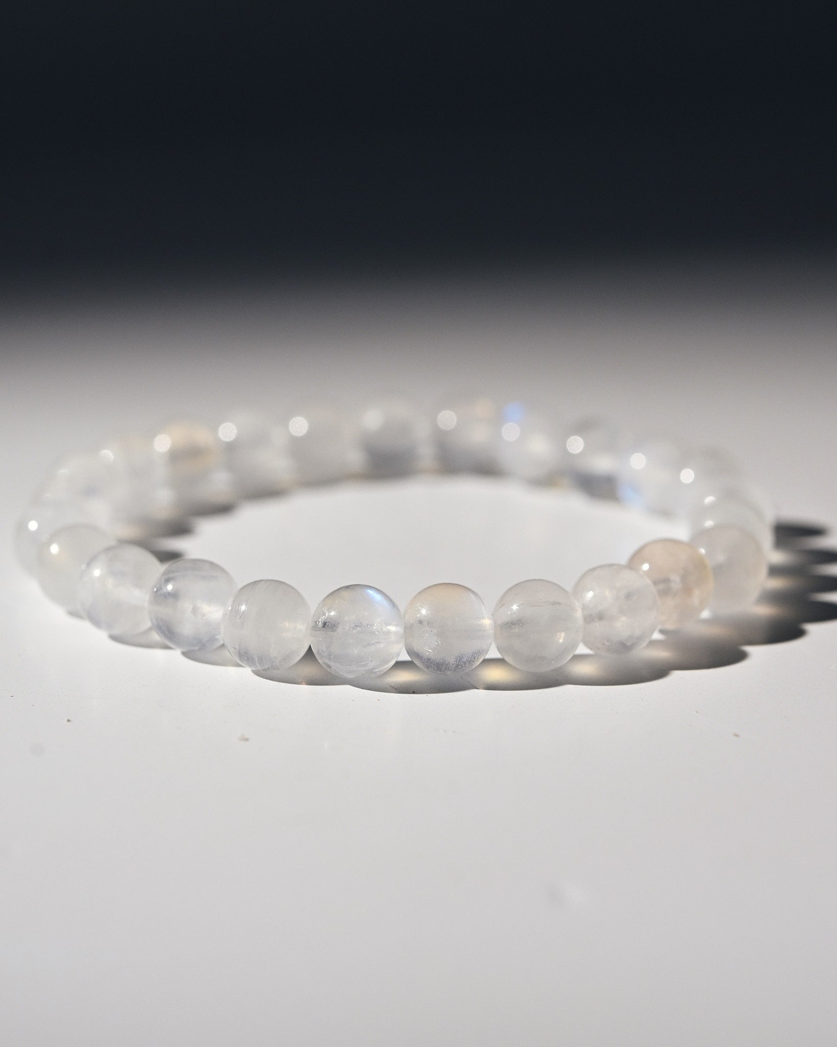White moonstone beaded bracelet on a white background